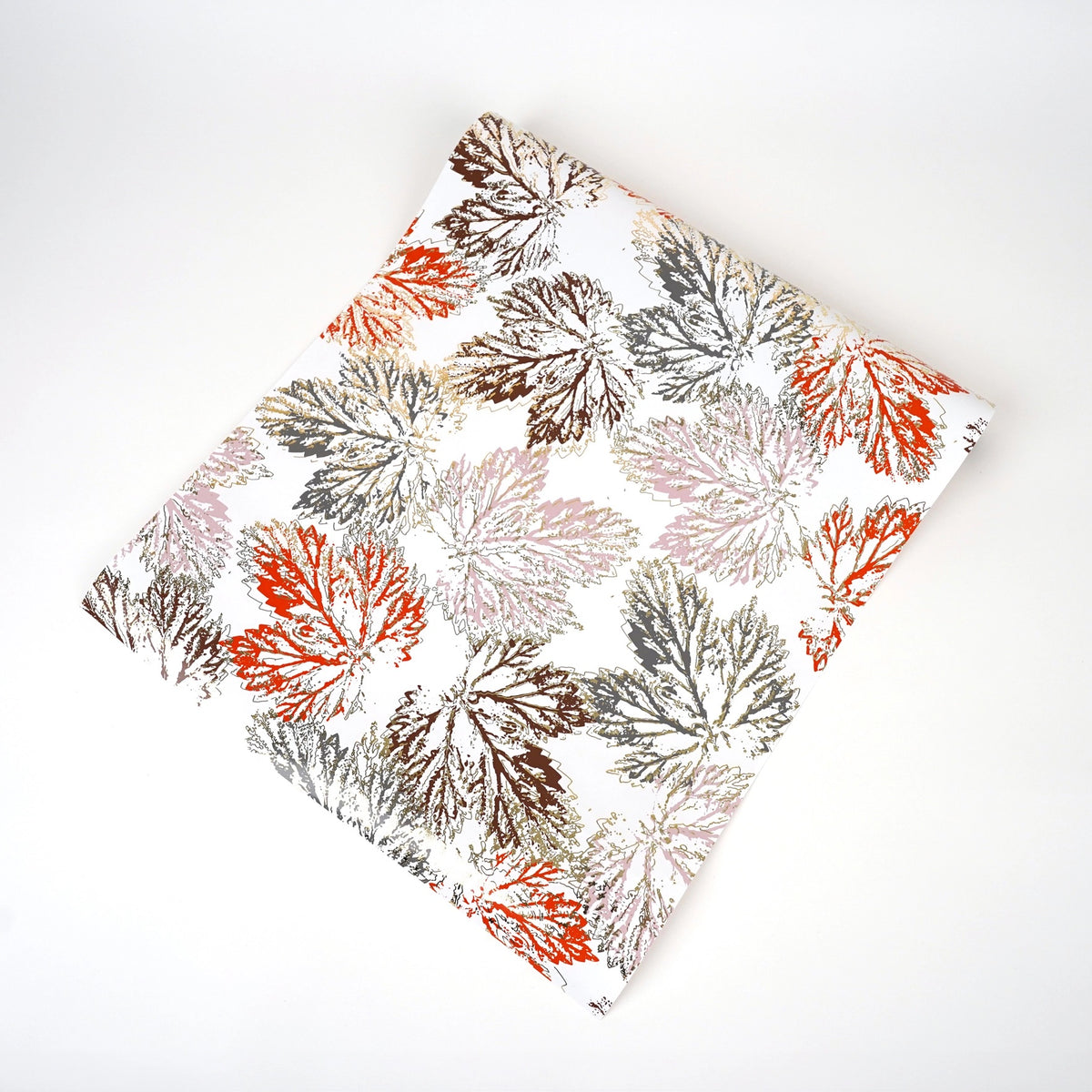 Paper table runner with leaf design