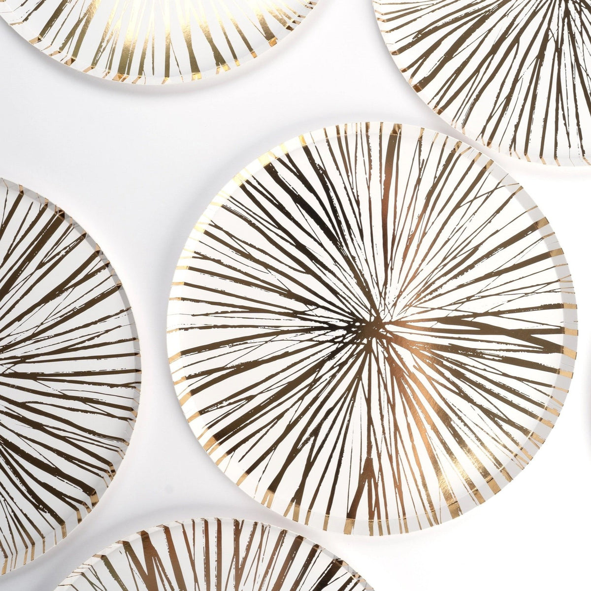 Close-up of white dinner paper plate with gold foil design, perfect for Christmas and Thanksgiving celebrations. Eco-friendly and recyclable, these 10.5-inch gold paper plates are ideal for elegant holiday dinners and gatherings.