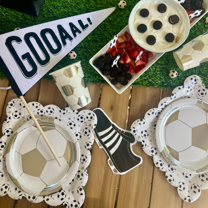 Tackle messes like a pro with our soccer napkins! Shaped like black soccer cleats, this set of 18 napkins is just what you need for your soccer birthday party.