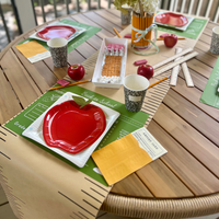 This set of 12 placemats features a word search and cursive practice section, cleverly designed to resemble a chalkboard. It’s the perfect way to mix fun and function, making your table setting both entertaining and educational.