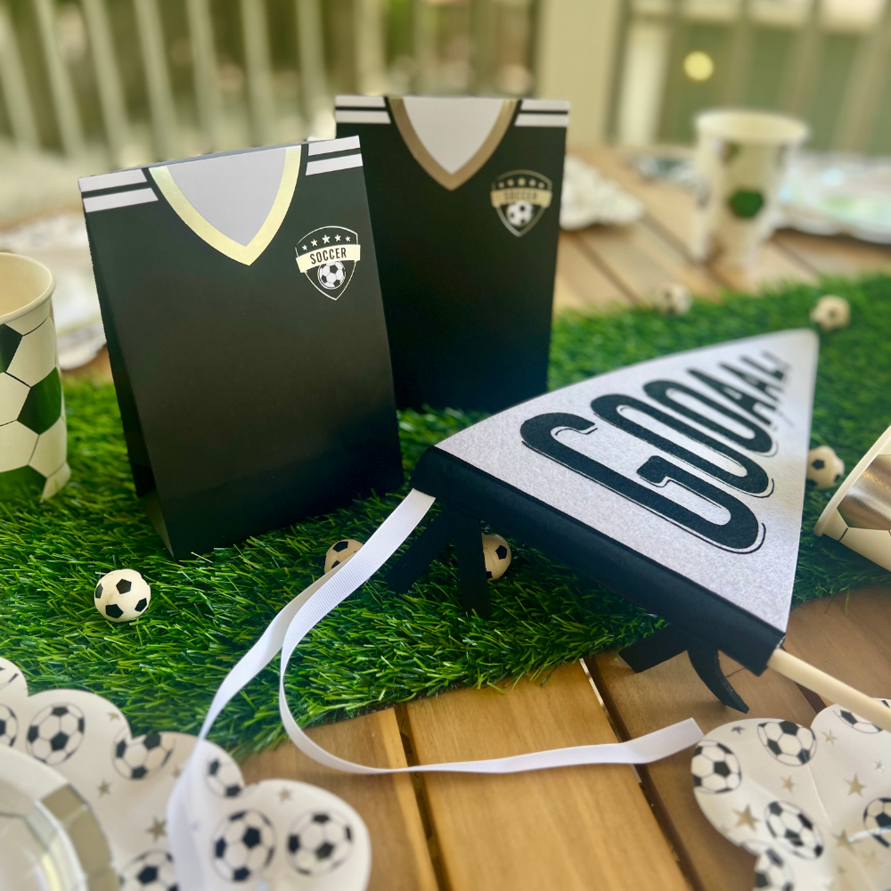 Tackle messes like a pro with our soccer napkins! Shaped like black soccer cleats, this set of 18 napkins is just what you need for your soccer birthday party.