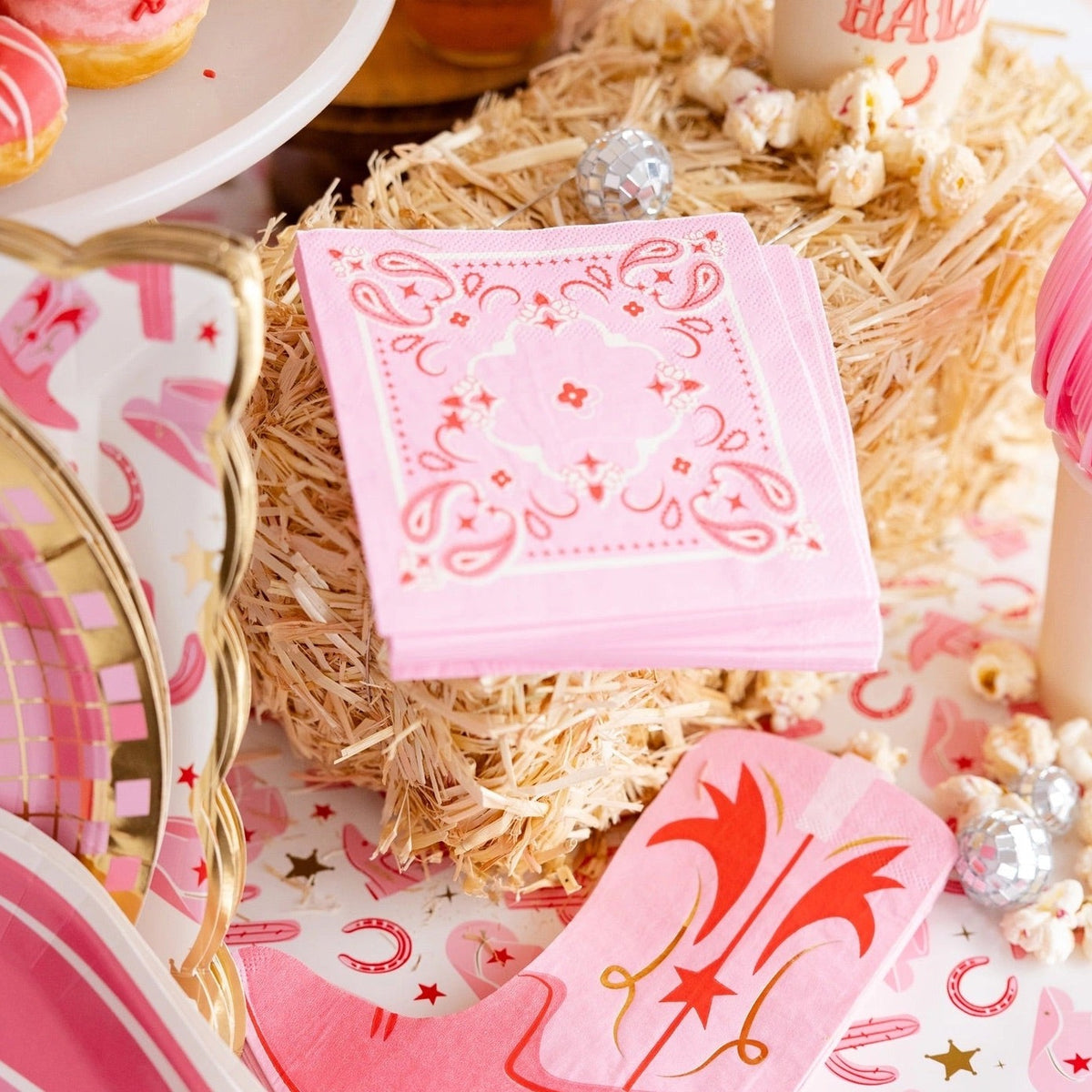 Keep your cowgirl party stylish and fun with our pink bandana paper cocktail napkins. The perfect addition to any celebration!