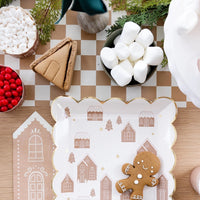 tan and white Checkered paper table runner with a gingerbread place setting