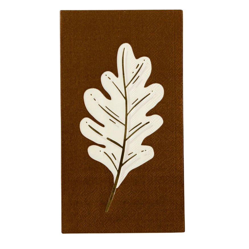 Single brown napkin featuring a white oak leaf design with gold foil details, ideal for fall napkins in Thanksgiving party decorations.