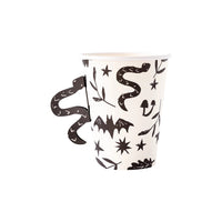 Set of 8 white paper Halloween cups with black designs of bats, snakes, and spooky plants, each with an adhesive black snake-shaped handle.