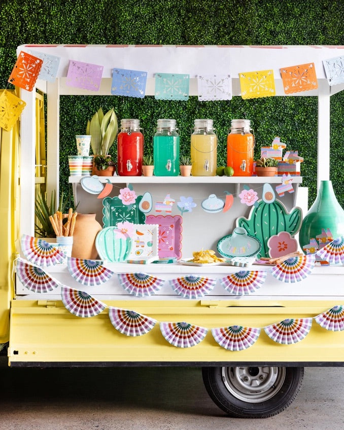 Fiesta Striped Fan Banner hanging above a Cinco de Mayo-themed party table.