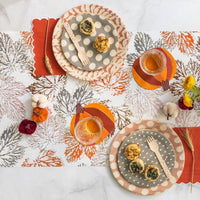 Paper table runner with leaf design with a fall table setting