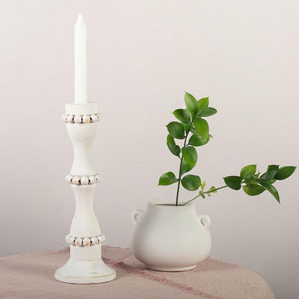 White wooden candle holders that are perfect to use as a centerpiece or throughout the home. These tall candlestick holders are perfect to gift to Mom for Mothers Day