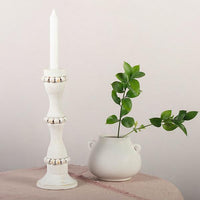 White wooden candle holders that are perfect to use as a centerpiece or throughout the home. These tall candlestick holders are perfect to gift to Mom for Mothers Day