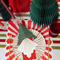 Holiday table setting with white and gold foil paper plates, perfect for Christmas, Thanksgiving, and other festive celebrations. These 10.5-inch eco-friendly gold paper plates add a touch of elegance to any holiday table.