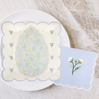 In Bloom Egg Plates styled on an Easter brunch table with matching pastel napkins and tableware.