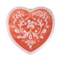 Close-up of heart-shaped Valentine plate showcasing its intricate folk-inspired floral pattern.