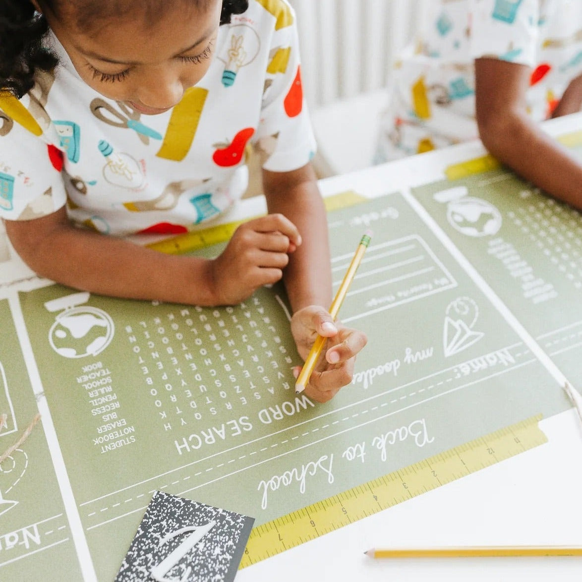 This set of 12 placemats features a word search and cursive practice section, cleverly designed to resemble a chalkboard. It’s the perfect way to mix fun and function, making your table setting both entertaining and educational.