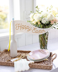 Spring Soiree Egg Plates paired with matching napkins and pastel tableware.