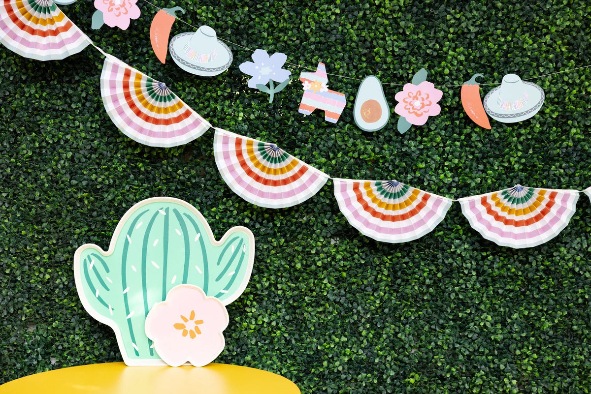 Detailed view of the tacos, maracas, and piñatas on the Fiesta Icon Banner.