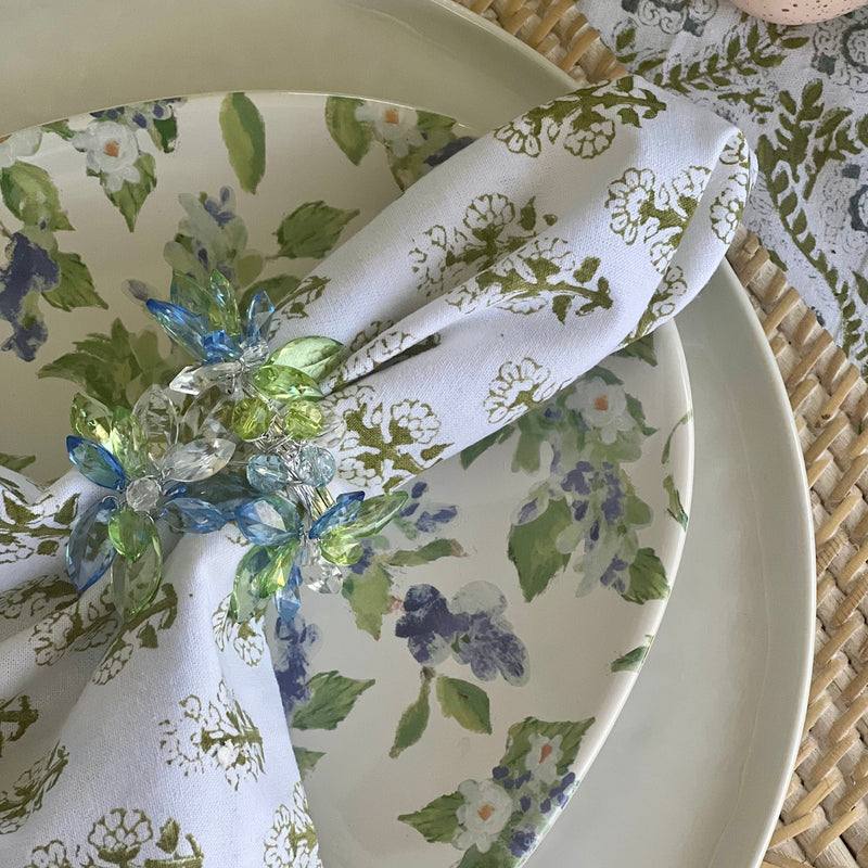 Blue and green jeweled napkin ring on a silver napkin ring - perfect for a Spring table or Mother's Day Brunch decor.
