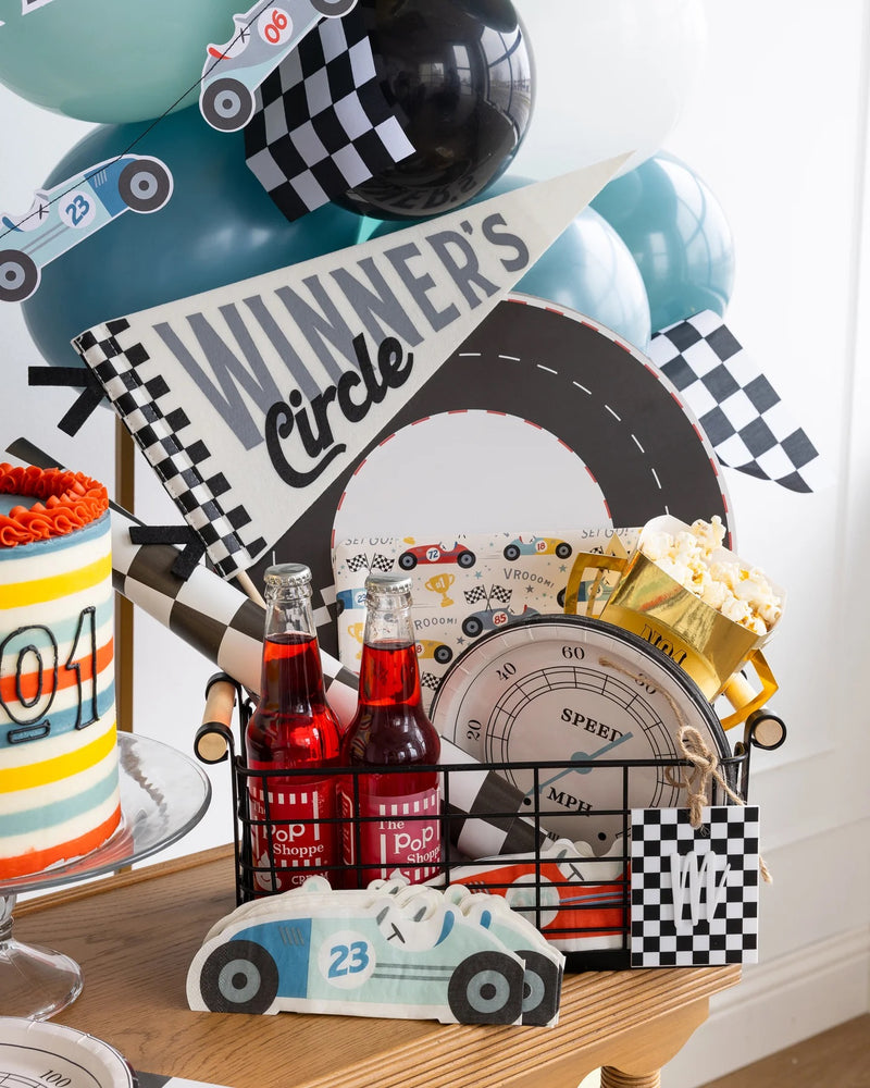 Vibrant Miles Per Hour Winners Circle Felt Pennant enhancing car-themed decorations at a Two Fast Birthday party.