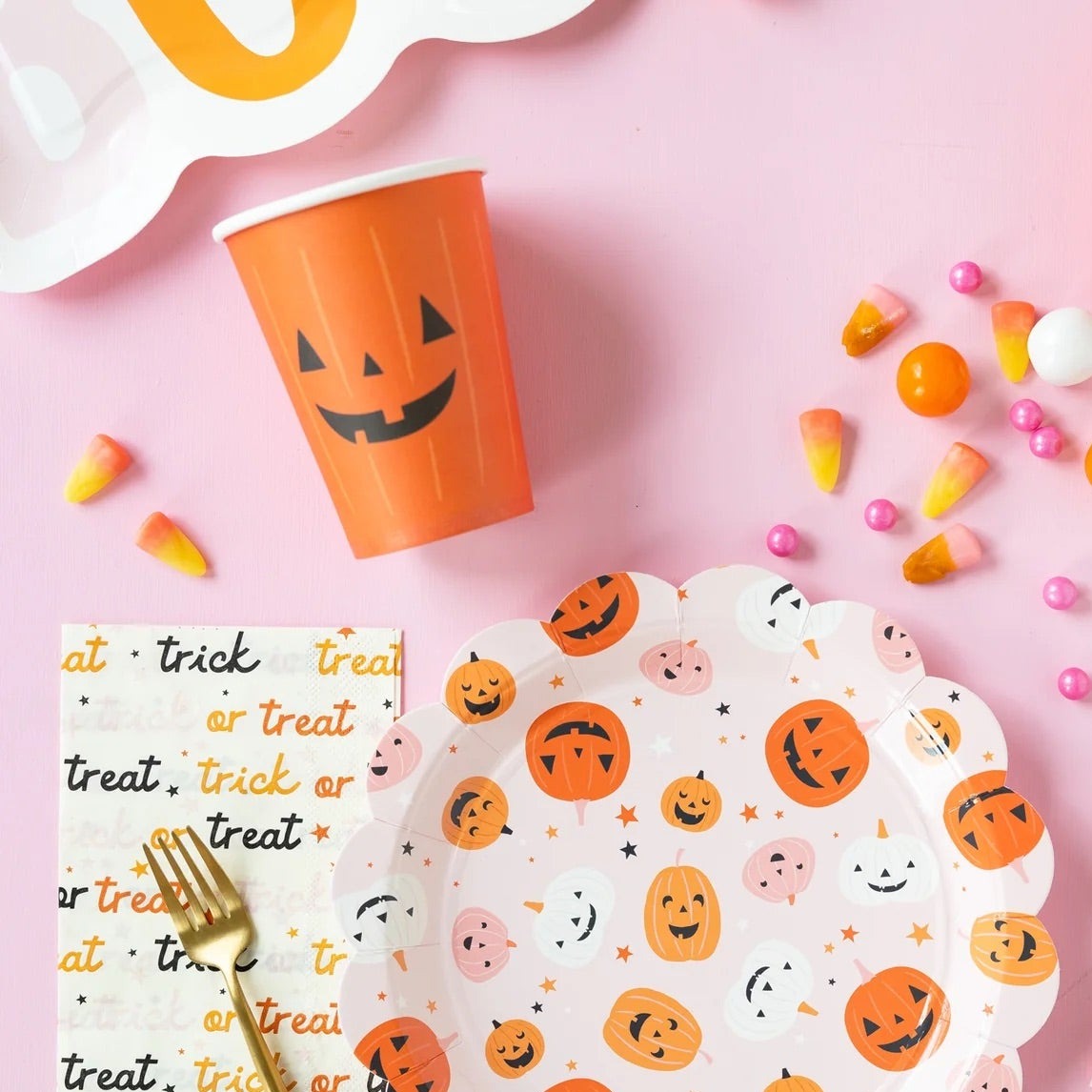 Set of 8 orange Halloween cups with jack-o-lantern design, each holding 12 oz.