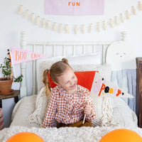 Halloween flag with Spooky text on a 15-inch felt pennant, attached to a 14-inch wood dowel for Halloween centerpieces.