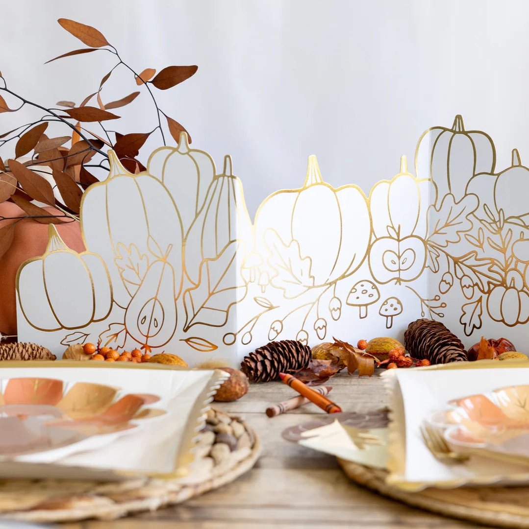 Kids coloring a Thanksgiving centerpiece with gold foil accents, perfect for Thanksgiving activities for kids.