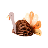 lose-up of a honeycomb turkey centerpiece with detailed orange and cream tail feathers, perfect for bringing playful charm to your Thanksgiving kids' table.