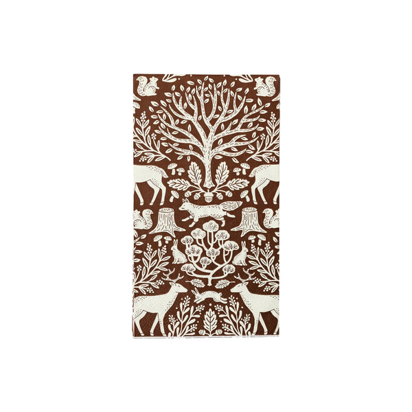 A brown toile fall napkin with intricate designs of trees, deer, and woodland creatures. This Thanksgiving napkin enhances the charm of any fall table setting with its rustic and natural style.