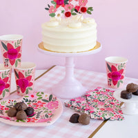 Floral heart-shaped Valentine plates styled on a decorated table with coordinating Valentine’s Day party decor.