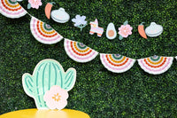 Fiesta Striped Fan Banner hanging over a Cinco de Mayo party table with festive decorations.