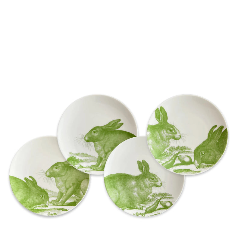White ceramic plates with green bunny designs.