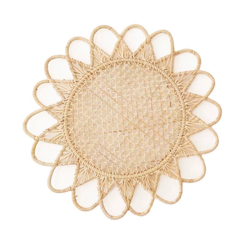 Rattan placemat with a boho design.