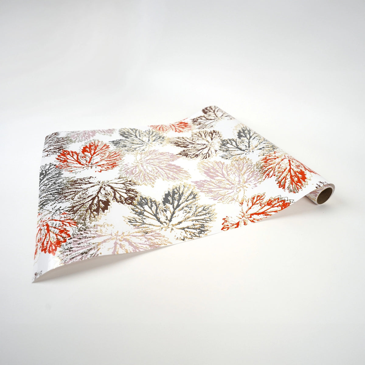 Paper table runner with leaf design