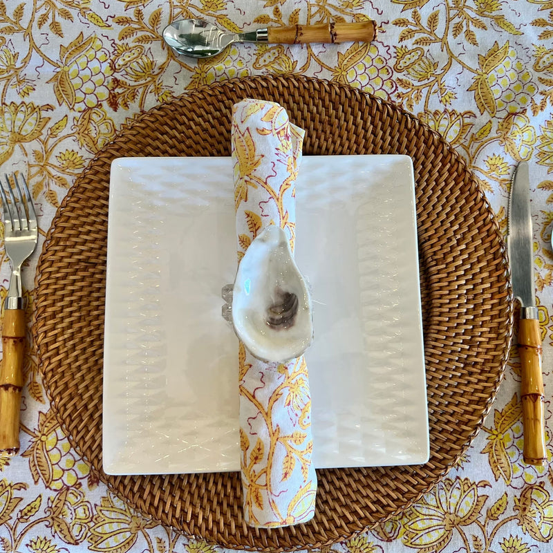 Bring the beach to your table settings with our Oyster Shell Napkin Rings. These napkin rings are the perfect addition to your tropical table decor, featuring real oyster shells finished in a shiny epoxy and mounted to acrylic rings with convenient velcro. Ideal for those who love a bit of the coastal vibe in their dining decor.