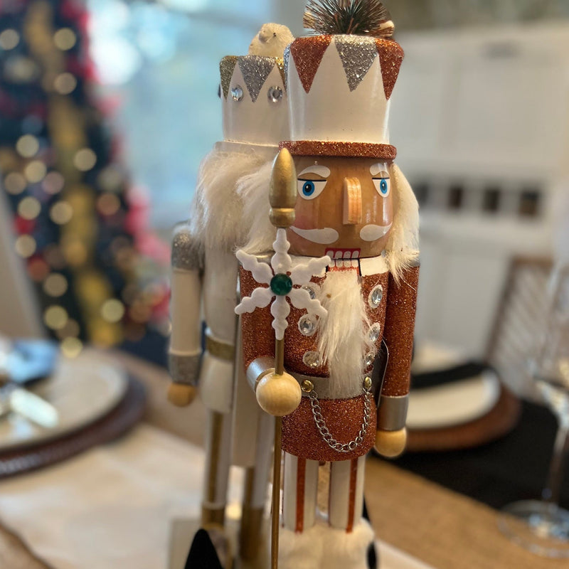 Gold and white Christmas nutcrackers perfect for a Christmas tablescape or Christmas coffee table decor.