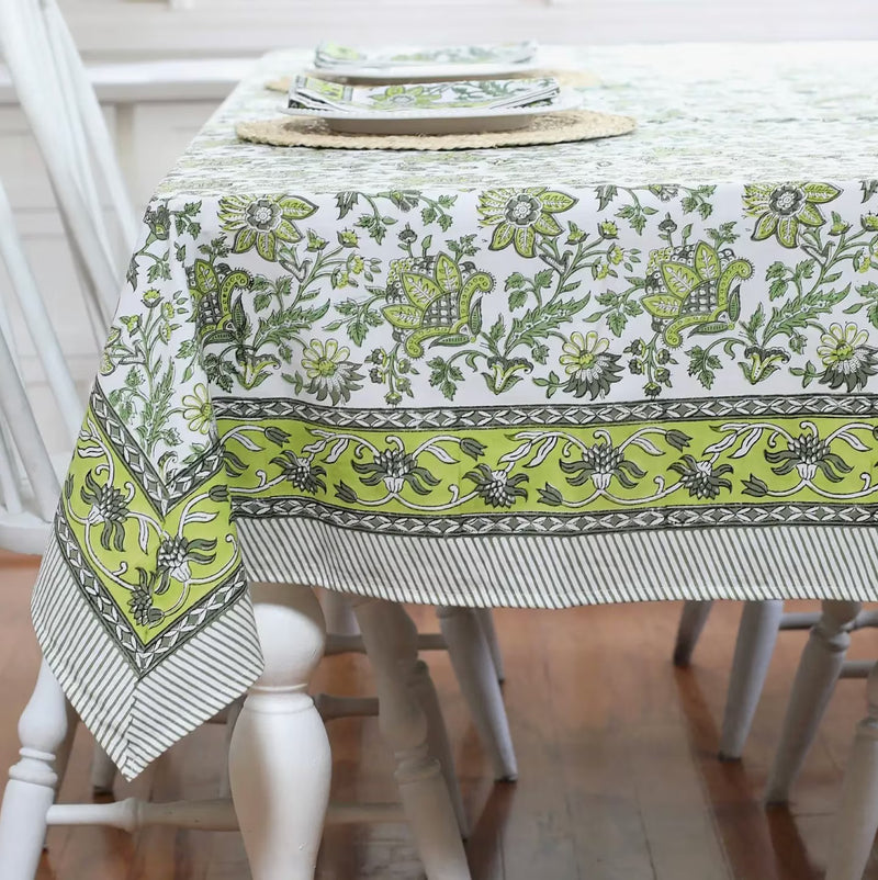 Discover the perfect backdrop for your summer celebrations with our Green Floral Tablecloth. Measuring 60"x 92", this tablecloth combines practicality with style, making it an essential addition to your garden party decor. Made from soft, durable cotton with a vibrant green and white block print, it’s not just a tablecloth—it’s a part of the party. Your guests will love this eye-catching floral tablecloth.