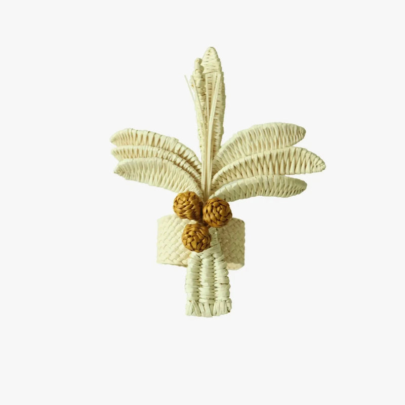 Escape to the tropics at every meal with our woven Palm Tree Napkin Rings. Crafted to complement your tropical table decor, these napkin rings feature natural-colored palm trees with brown coconuts, adding a coastal touch to your table. Perfect for hosting a luau or simply spicing up dinner, these palm tree napkin rings offer an instant vacation vibe.