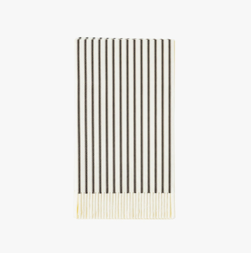 White and black stripe paper napkins with white fringe.