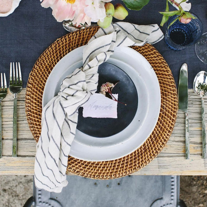 Transform your dining experience with our Tan Rattan Charger Plates. Ideal as Spring Charger Plates or for enhancing your Everyday Table, these 13-inch Rattan Placemats seamlessly blend style and functionality, perfect for both casual meals and special events.