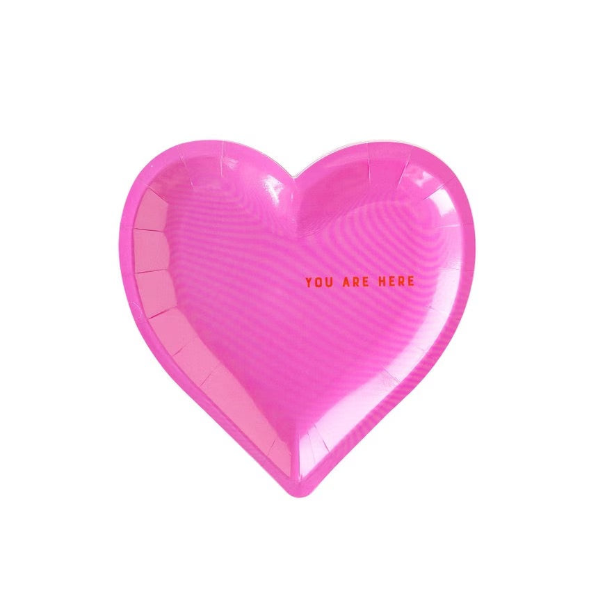 Pink heart shaped paper plates with the words you are here - perfect for a valentines day party or a bachelorette party