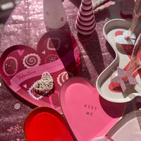 Red heart-shaped box of chocolate paper plates perfect for Valentines Day or an anniversary party