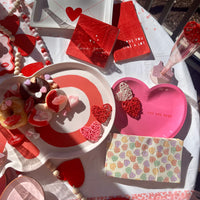 Pink heart shaped paper plates with the words you are here - perfect for a valentines day party or a bachelorette party