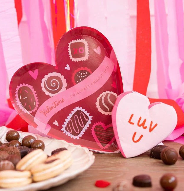 Red heart-shaped box of chocolate paper plates perfect for Valentines Day or an anniversary party