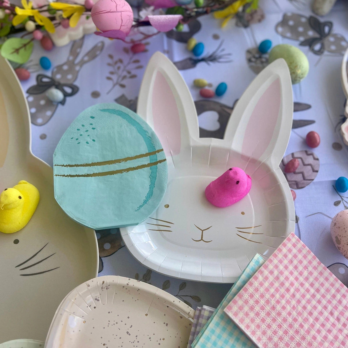 Paper Easter plates shaped like the face of a cute Easter Bunny face.