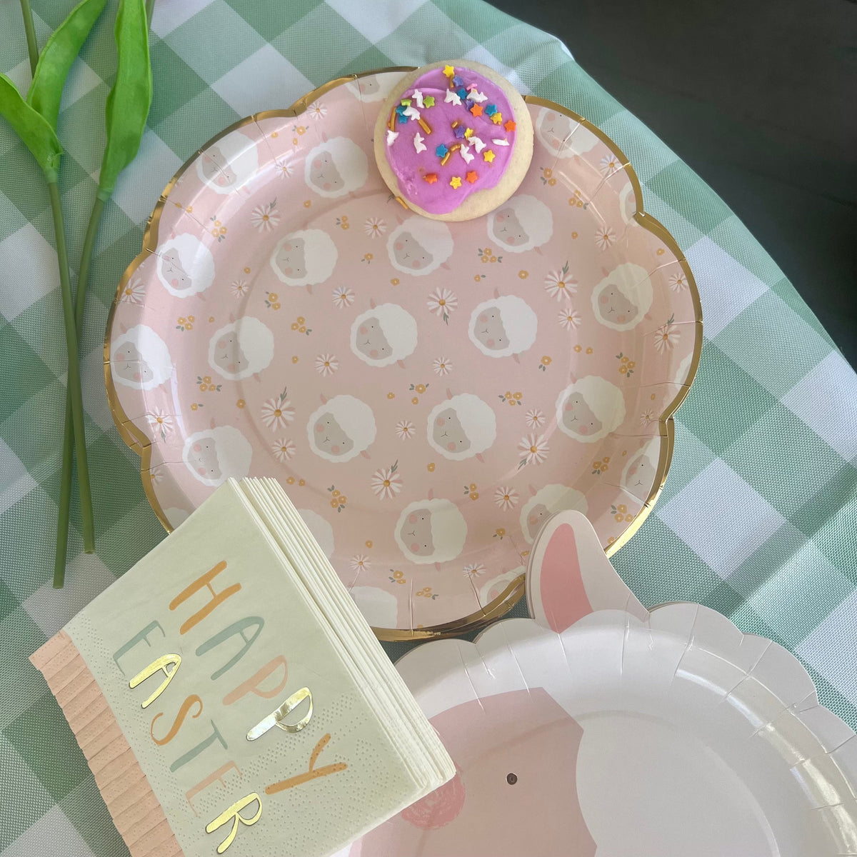 Pink easter paper plate with a lamb face design -scalloped edge with a gold edge