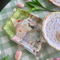 Easter paper plates shaped like a house with little bunnies inside. Perfect for a kids easter party